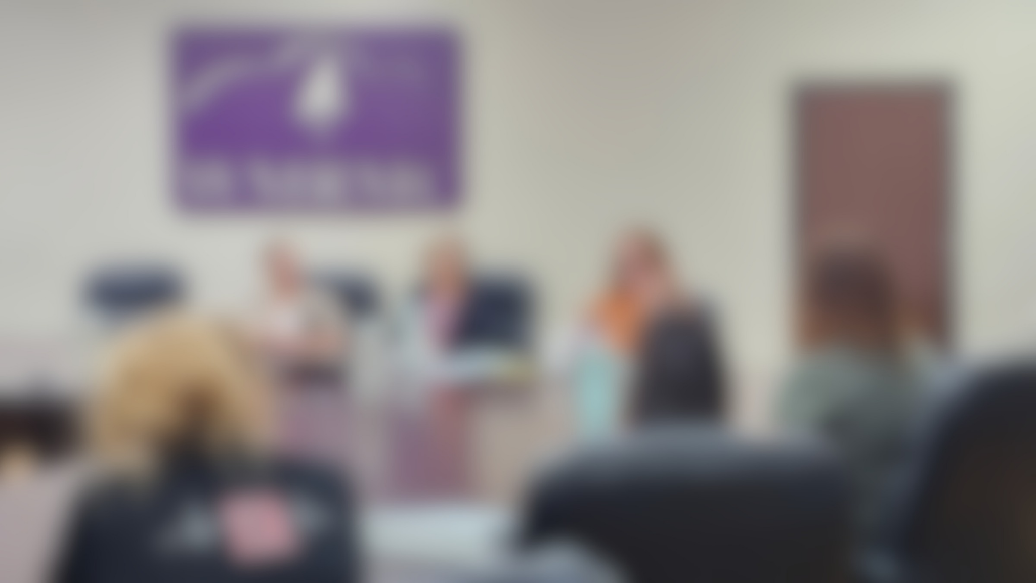 blurred image of the hospital board room during a meeting